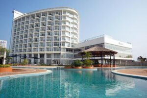Baywatch Hotel tower and infinity pool deck overlooking Inani Beach, Cox's Bazar
