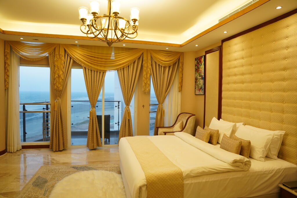 Premium suite bedroom with sea-view balcony at Baywatch Hotel, Cox's Bazar