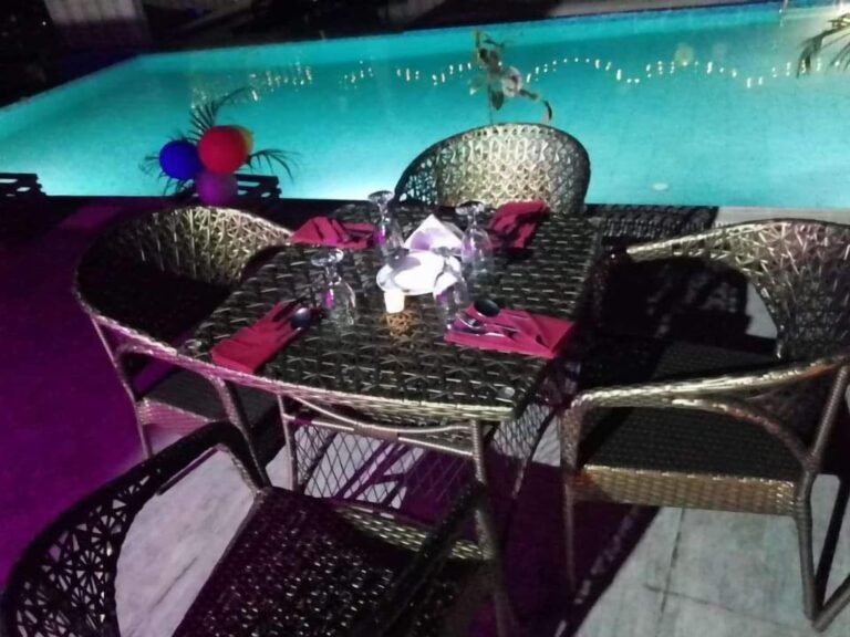 Rooftop lounge at night at Hotel Tower Inn, Chattogram