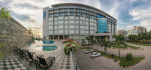 Ocean Paradise Hotel and Resort building with outdoor pool and stone accent wall, Cox's Bazar