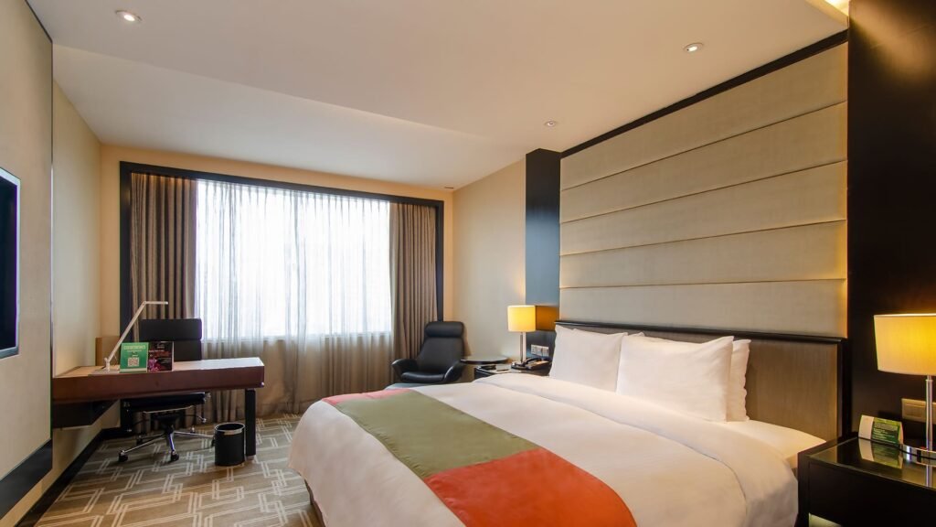Premier Room king bed and workspace at Pan Pacific Sonargaon Dhaka