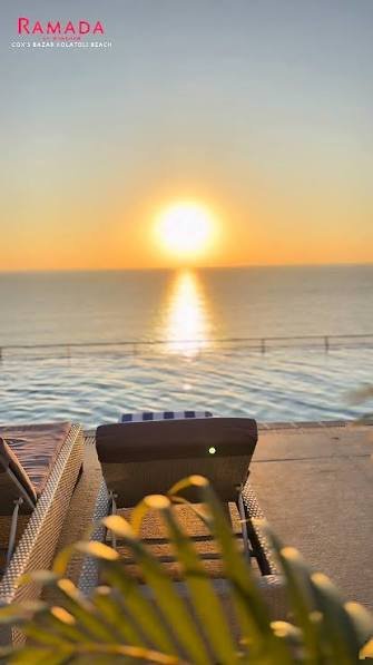 Sunset view over the Bay of Bengal from the rooftop pool deck at Ramada by Wyndham Cox's Bazar Kolatoli Beach
