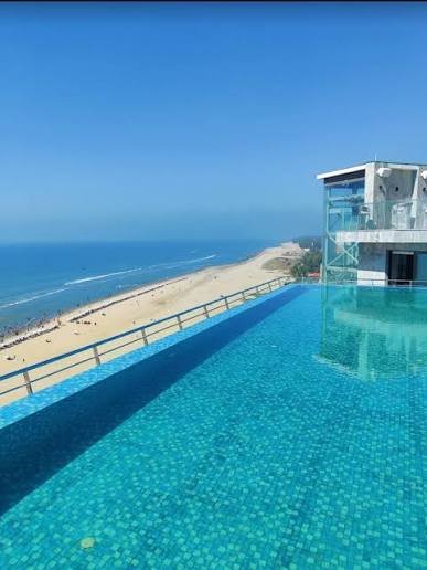 Rooftop infinity swimming pool at Ramada by Wyndham Cox's Bazar with a view over Kolatoli Beach