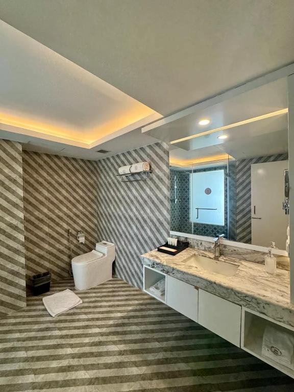 Bathroom with rain shower at Grand River View Hotel Rajshahi