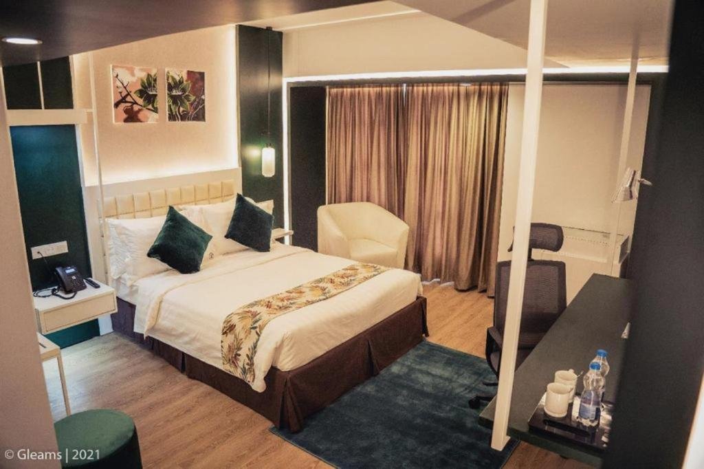 Grand River View Hotel room with green accent wall