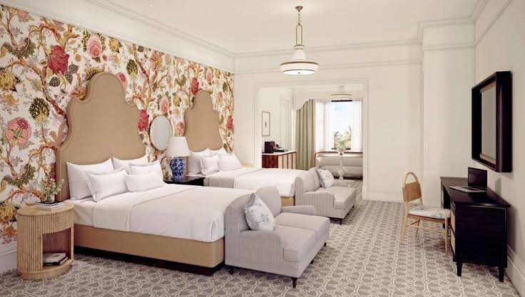 Guest room with floral wallpaper in the Victorian building at Hotel del Coronado