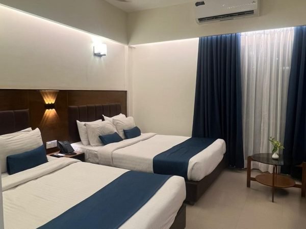 Deluxe Four Bed city-view guest room with twin beds at Hotel Kollol