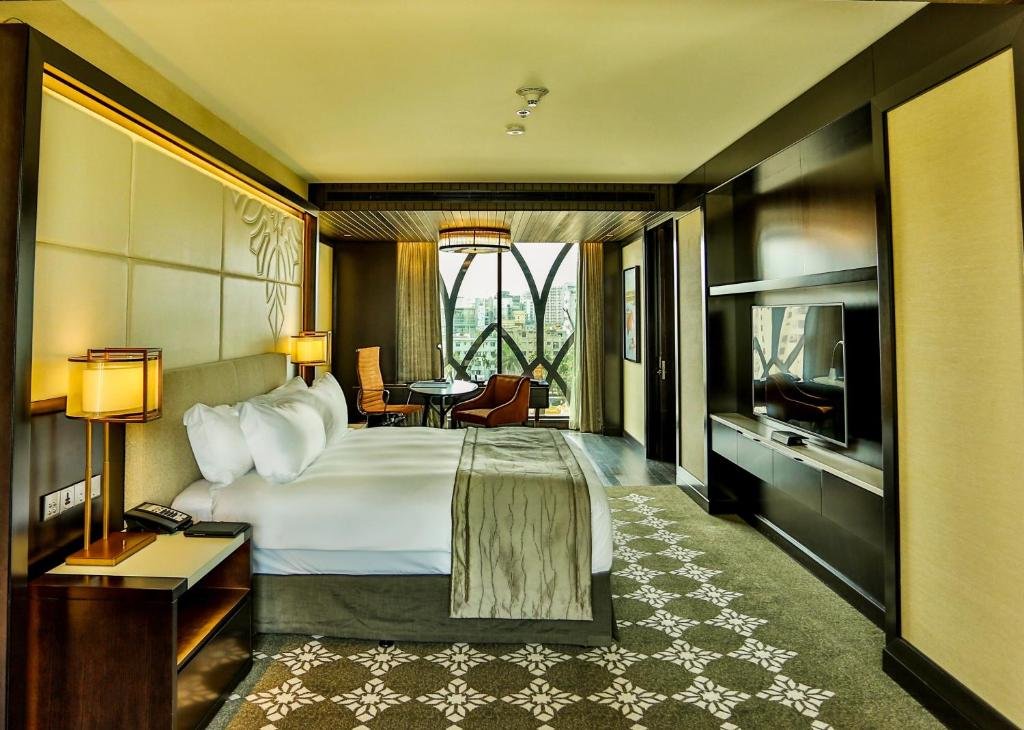 Guest room with king bed and city view at InterContinental Dhaka