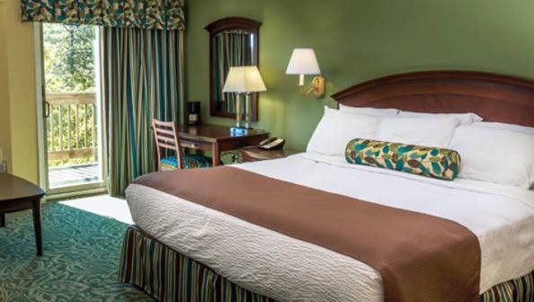Hotel room with a king bed at Massanutten Resort
