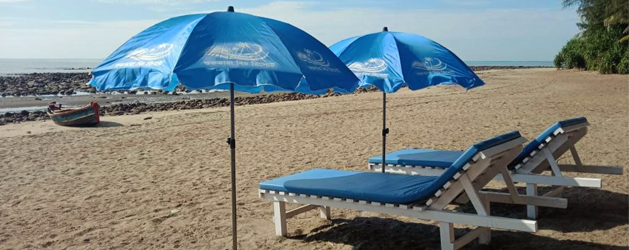 Beach loungers and umbrellas at Shuktara Beach Resort
