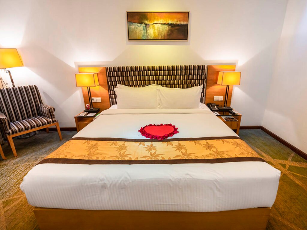 Deluxe room with king bed and rose petal decoration at Hotel Bengal Canary Park, Gulshan, Dhaka